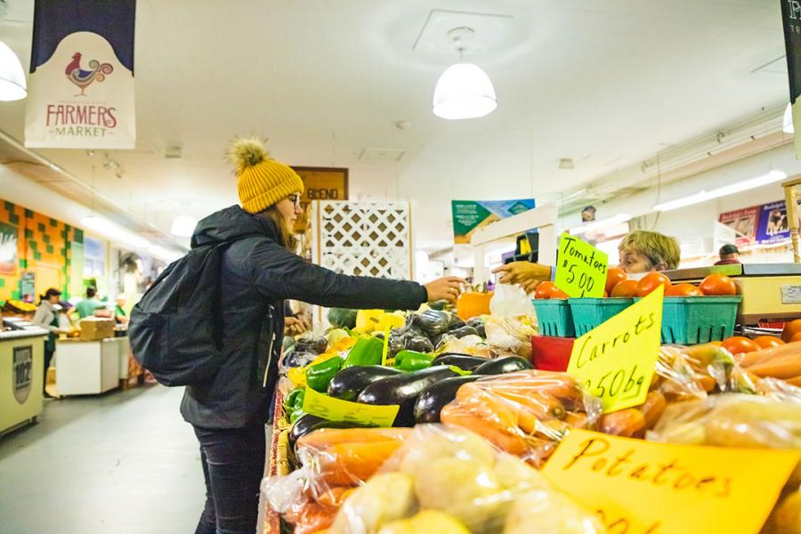 Buying fresh produce at the Fredericton Boyce Farmers Market