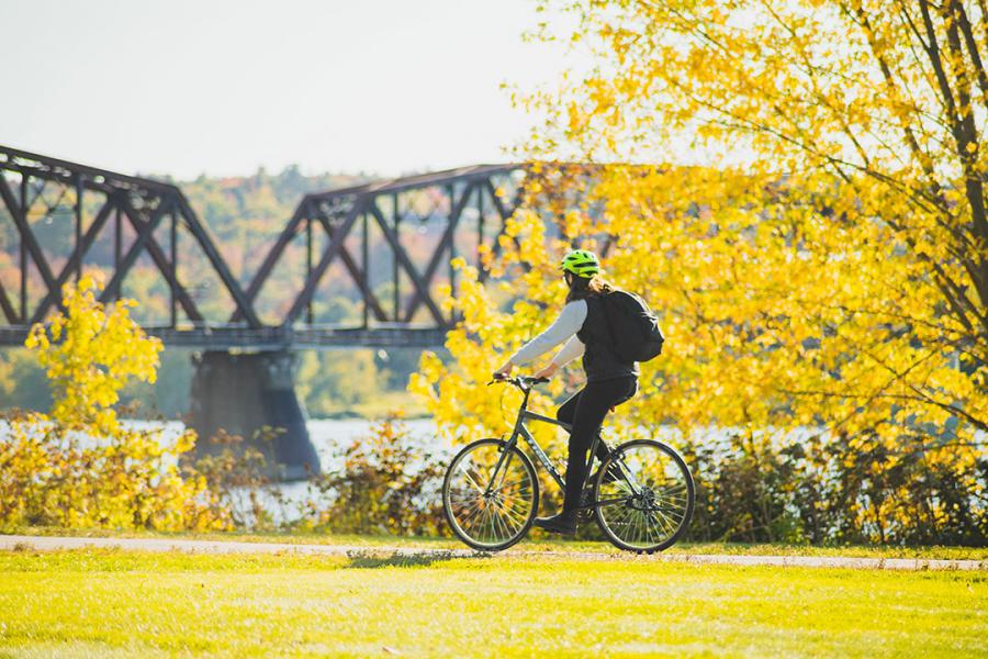 Biking along the trail leading to the Bill Thorpe Walking Bridge.
