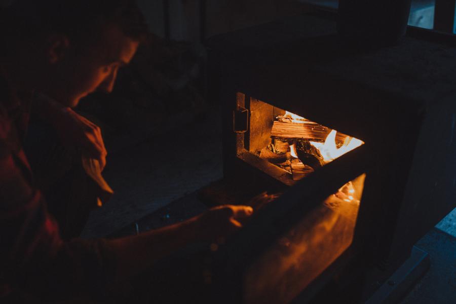 Starting up a fire in the warm-up shelters.