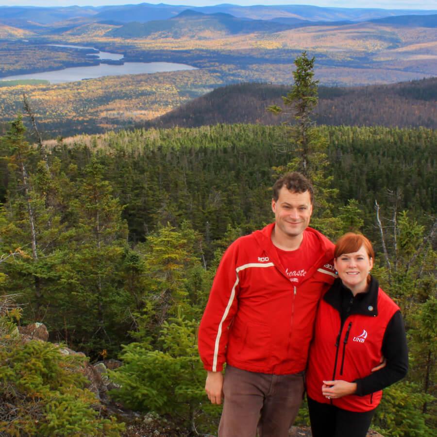 James and Vicki at the top of Mount Head in Mount Carleton Provincial Park, with Pine Point and Bathurst Lake in the background