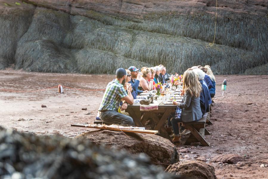 a group dining on the ocean floor in st martins