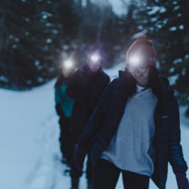 3 girls hiking in the winter at night