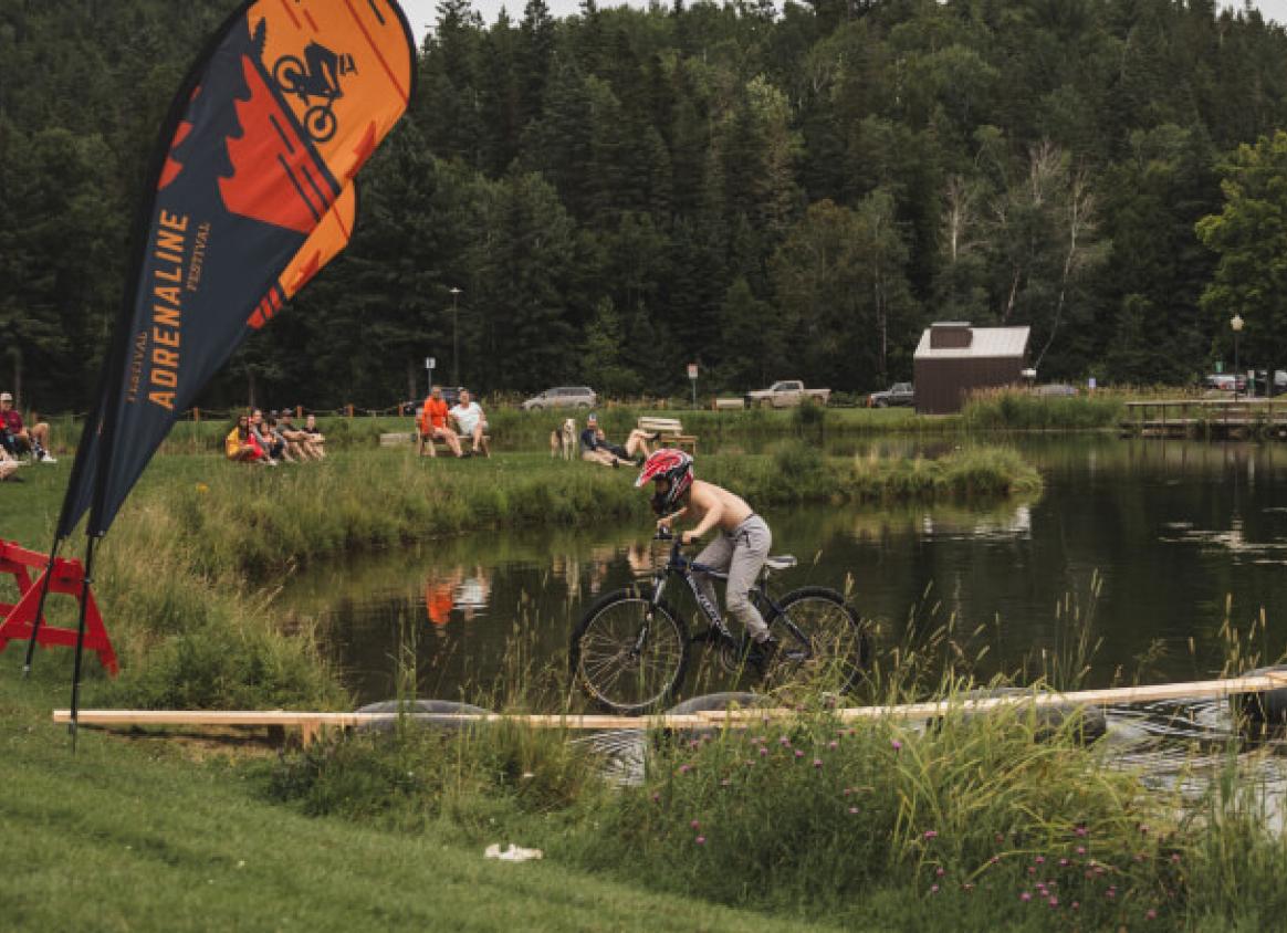 Cyclist riding over a lake