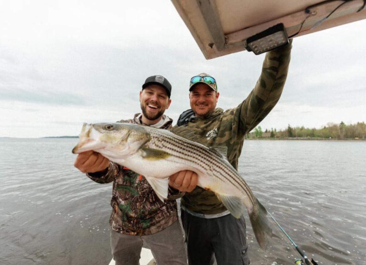 Two men with large fish